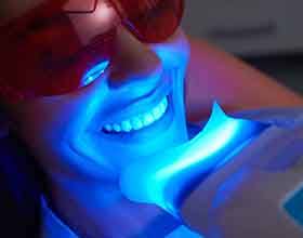 Someone receiving whitening treatment