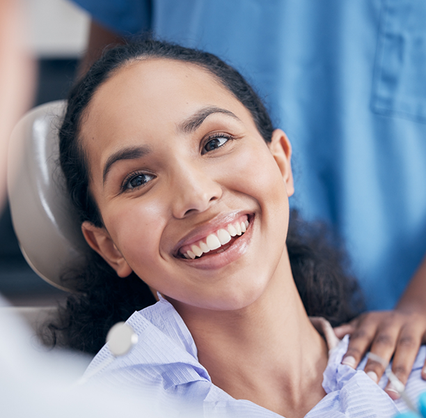 Smiling woman in the dental chair
