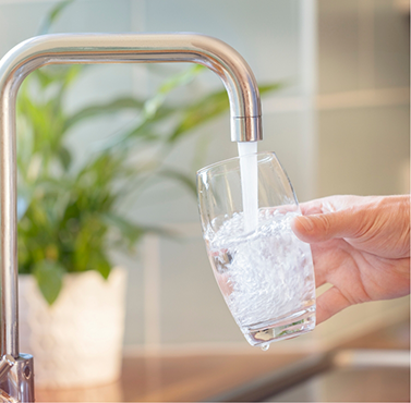 Filling a glass of water in the sink