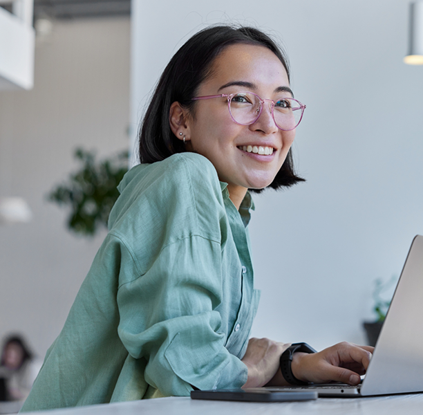 Young woman using a laptop in an office